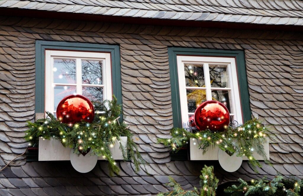 Windows dressed with Christmas wreaths and ornaments