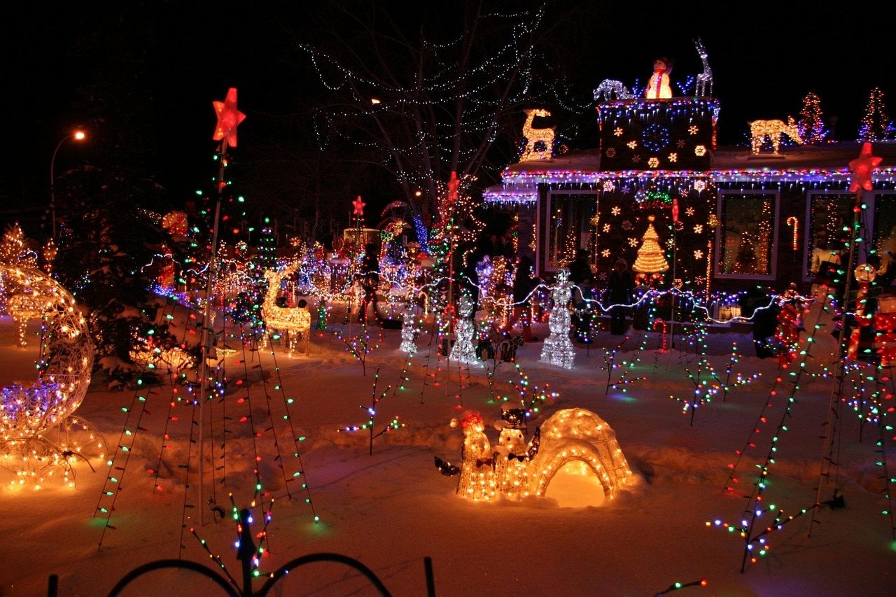 Home covered in Christmas lights and yard displays