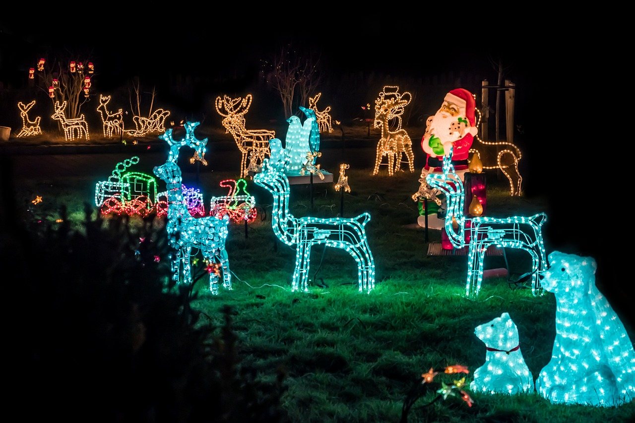 Lit reindeer display in a front yard