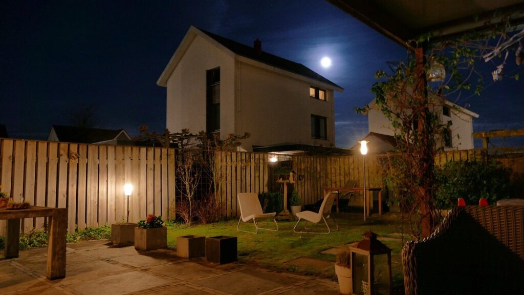 House with roofline lights on a clear night