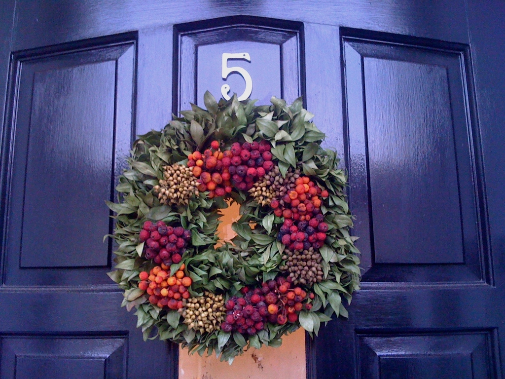Christmas wreath on a blue front door