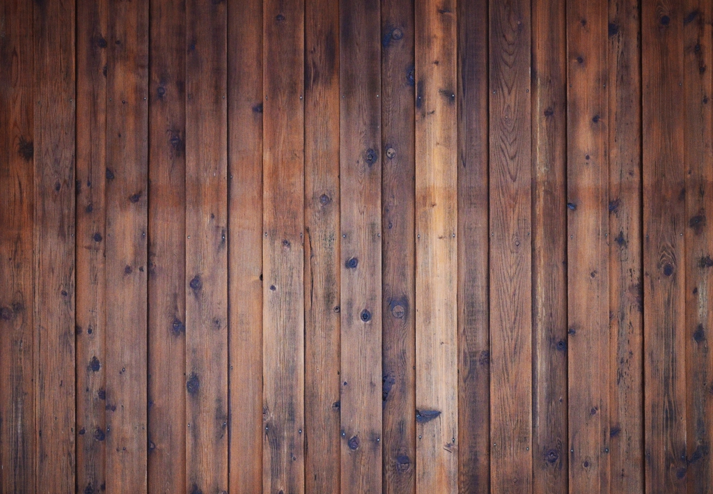 Dark stained wood fence planks