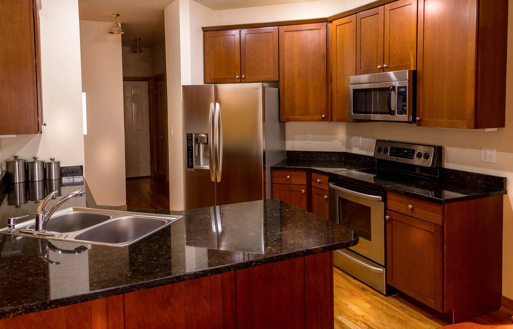 Kitchen with cherry cabinets and granite countertops