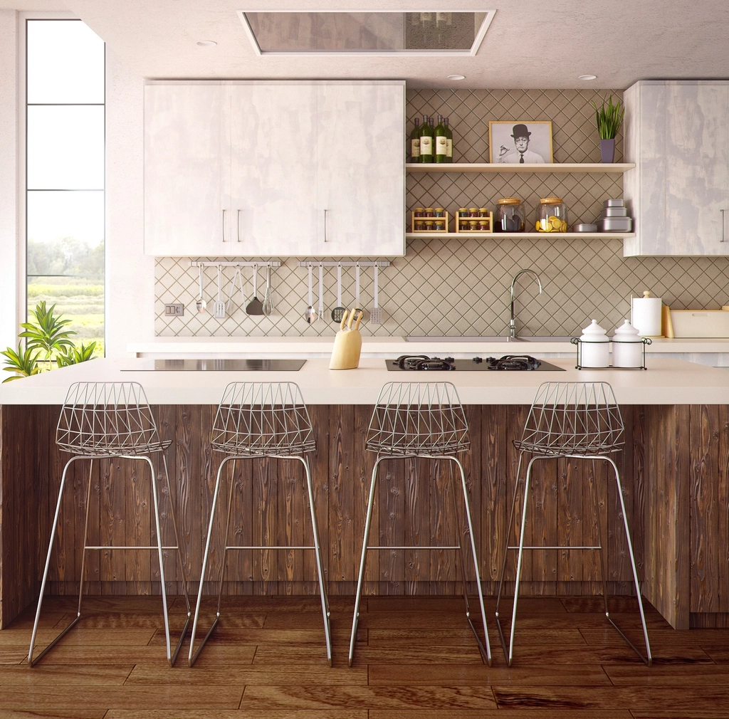 Kitchen island with wood paneling and bar stools