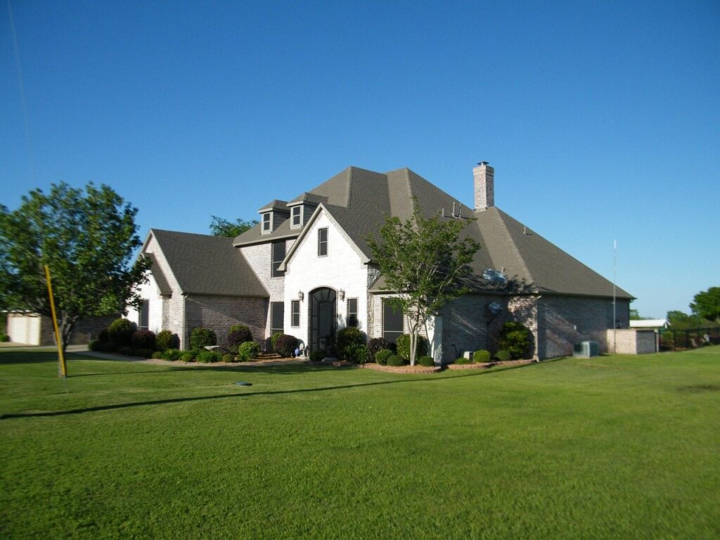 White farmhouse after exterior painting