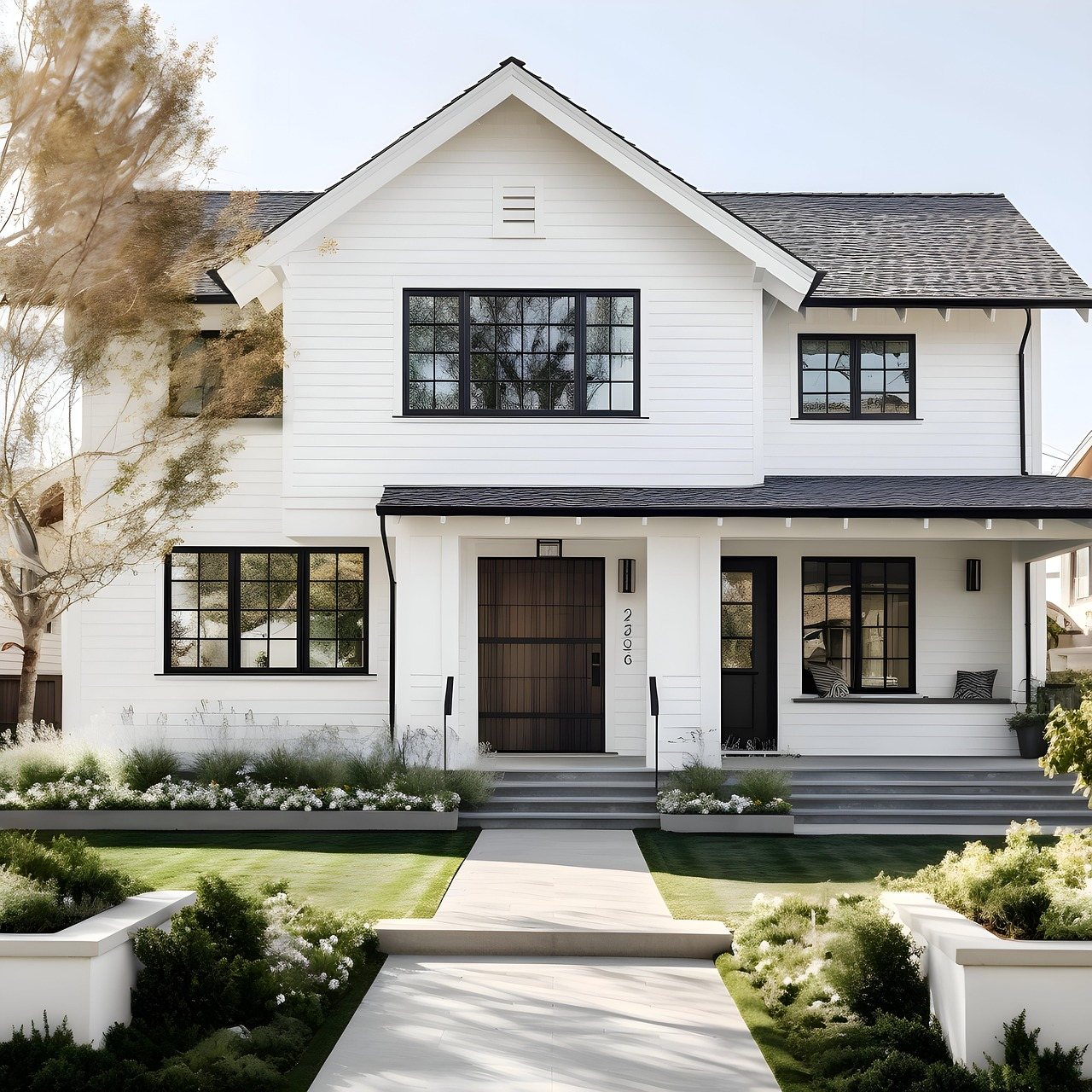 Freshly painted white home with dark trim