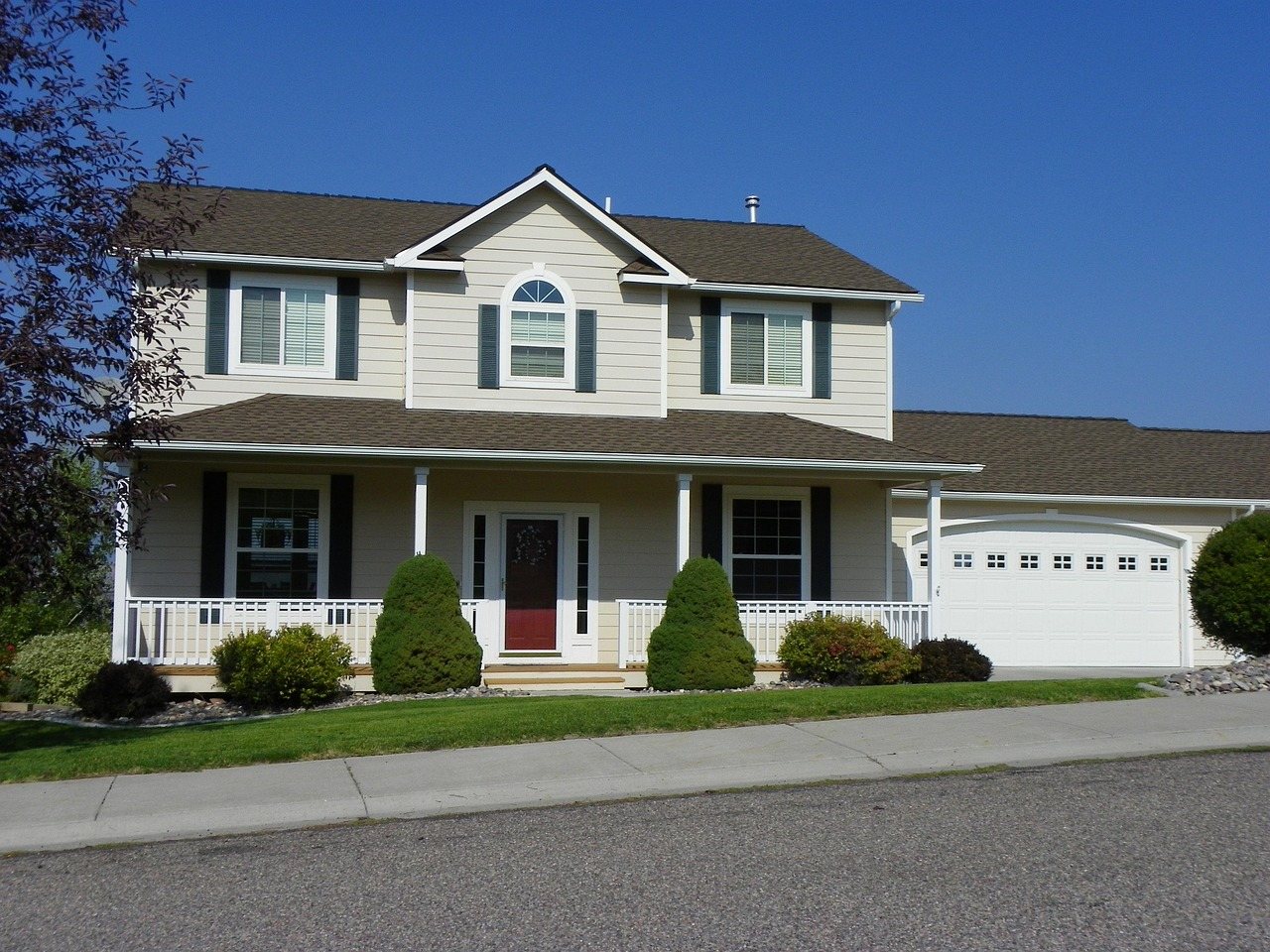 Two-story home with freshly painted siding