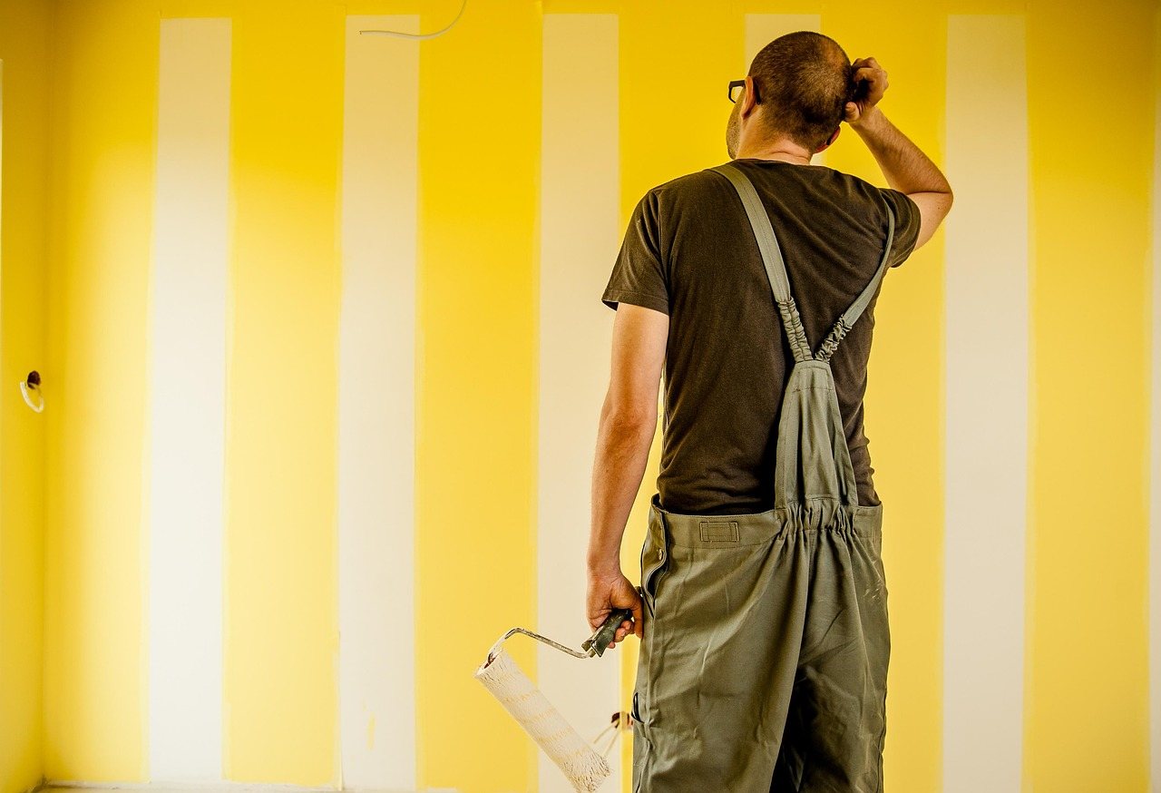 Painter rolling a fresh wall of color